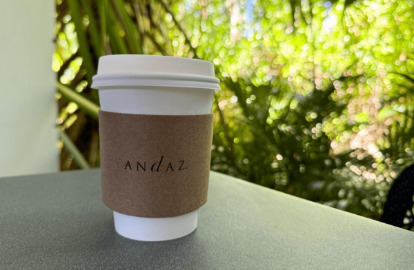 to-go cup of coffee placed on table in lobby